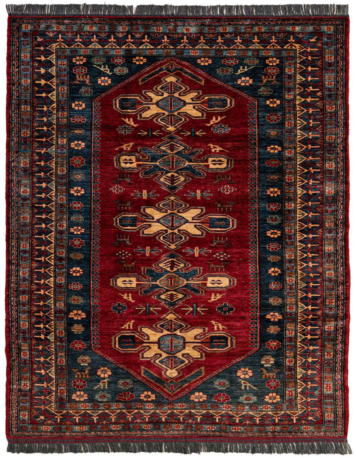 A 6x9 rectangular red and blue traditional Oriental rug with intricate geometric patterns and fringe.