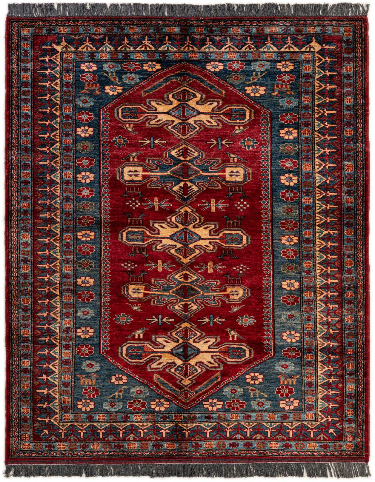 A 5x7 rectangular Rugs.com Kazak rug with a deep red field, intricate blue and gold traditional Oriental patterns, and a fringed edge.