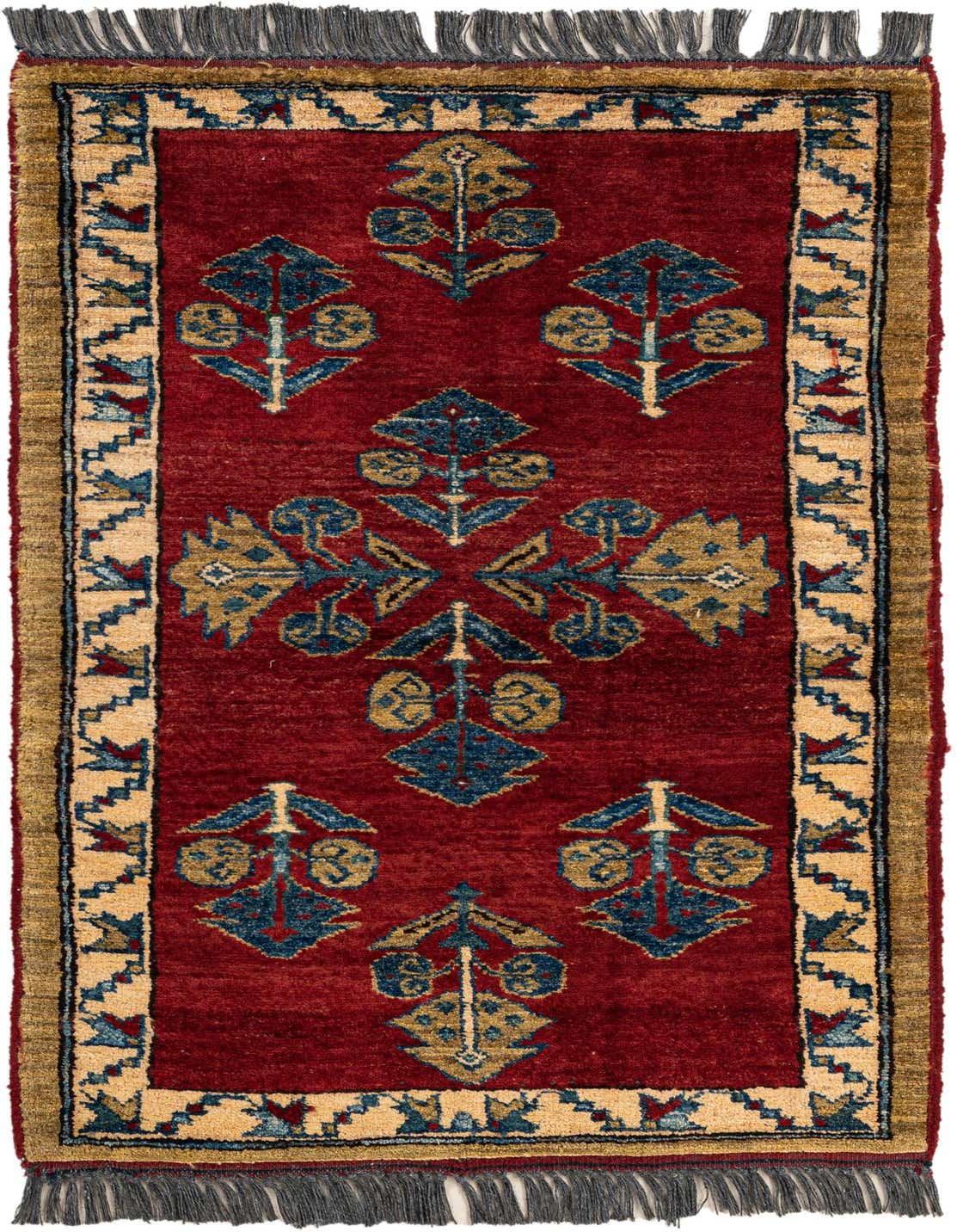 A 2x3 rectangular Rugs.com Kazak rug with a deep red field and repeating blue and gold oriental motifs, bordered by a tan and blue geometric pattern, with dark gray fringe.