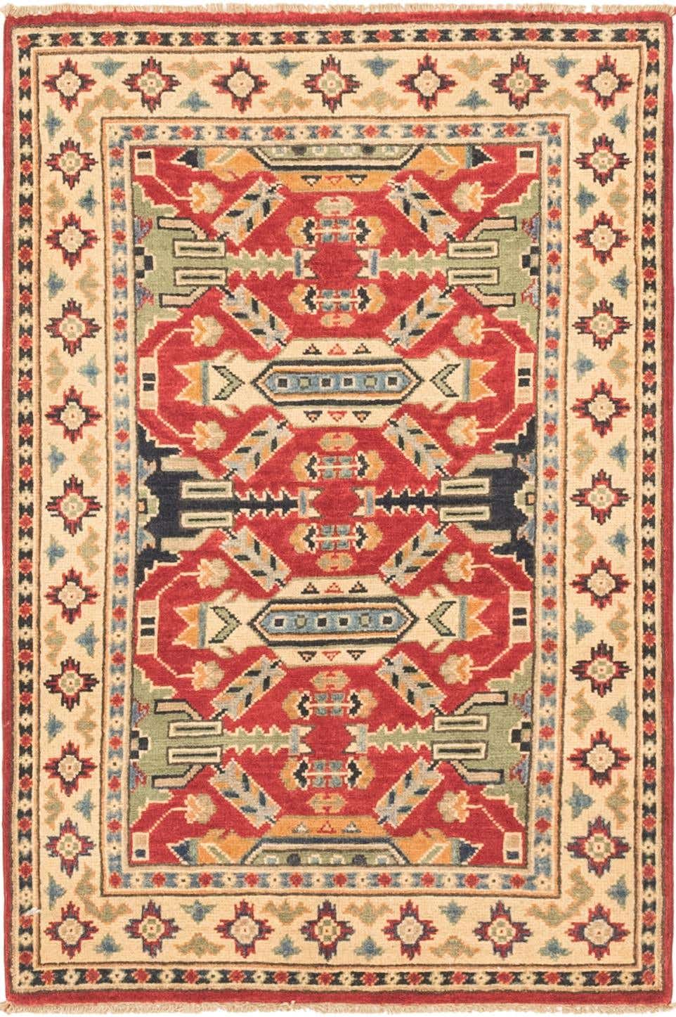 A 3x4 rectangular Rugs.com Kazak rug with a vibrant red field and intricate tribal patterns in blue, green, and gold, framed by a cream border with geometric motifs.