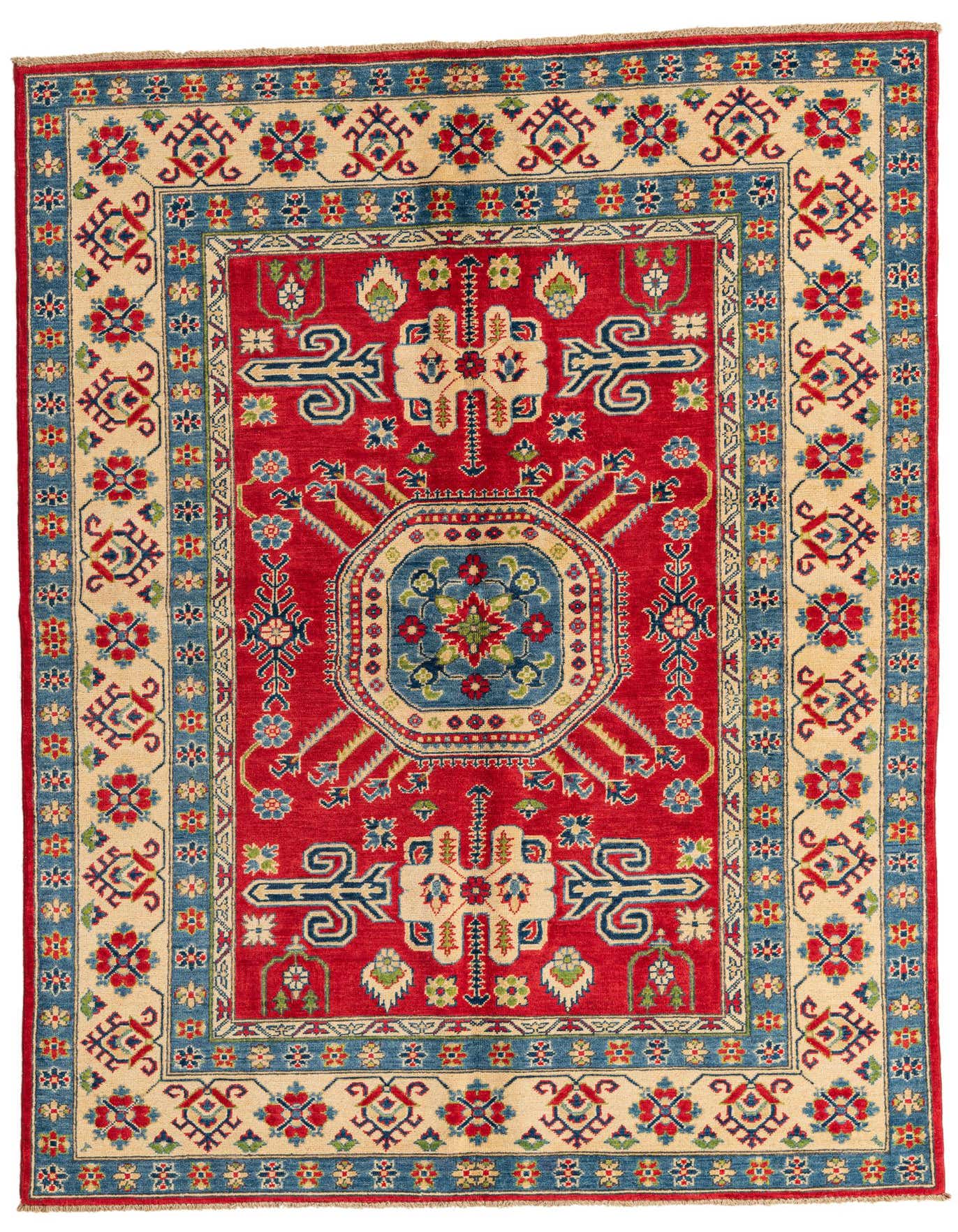 A 6x9 rectangular red Kazak rug with a central blue medallion and intricate traditional patterns in red, blue, and cream.
