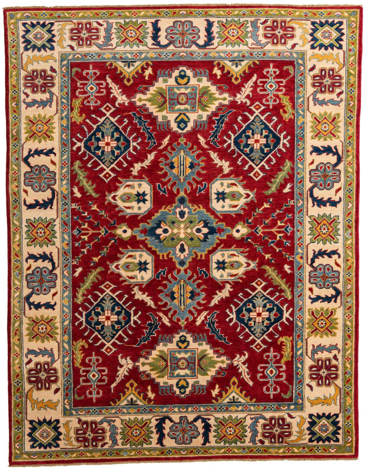 A 6x9 rectangular Rugs.com Kazak rug with a deep red field and intricate traditional Southwestern patterns in blues, greens, and gold, bordered by a cream band with floral motifs.