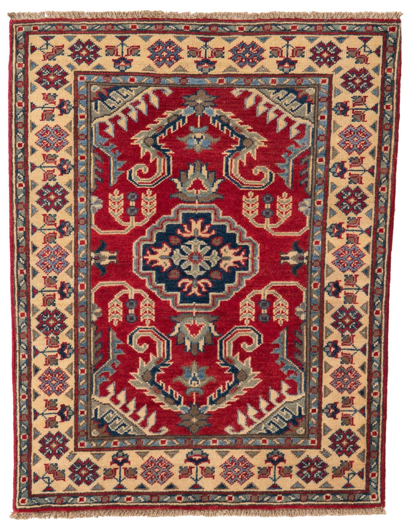 A 3x4 rectangular Rugs.com Kazak rug featuring a bold red field with a central medallion and intricate traditional patterns in blue, beige, and brown.