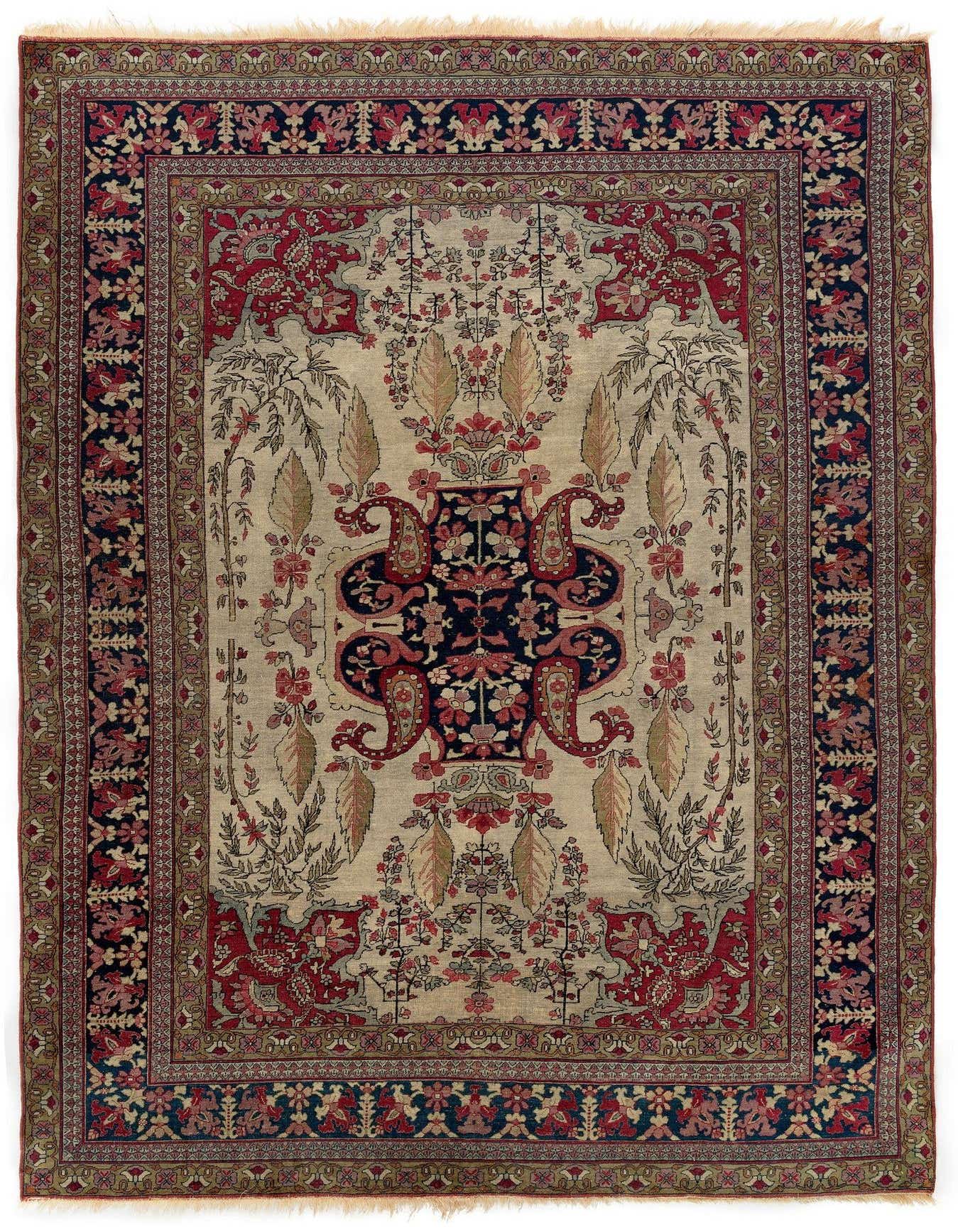 A rectangular 4x6 Kerman wool rug featuring a central navy and red medallion on a cream field, surrounded by intricate floral and paisley patterns, with a multi-bordered edge in deep red and navy.