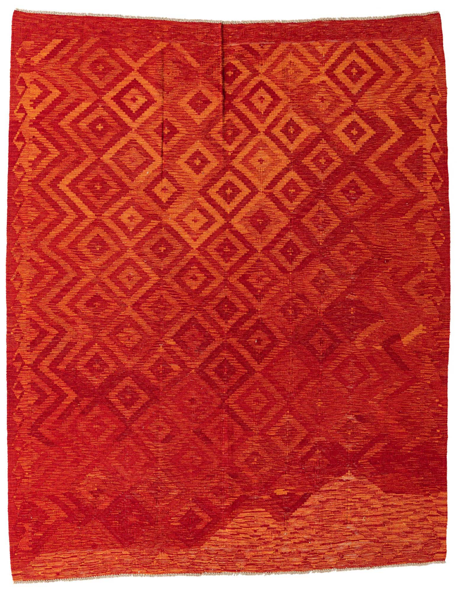 A 6x9 rectangular red flatweave rug with a Southwestern-inspired tribal diamond pattern in varying shades of red and orange.