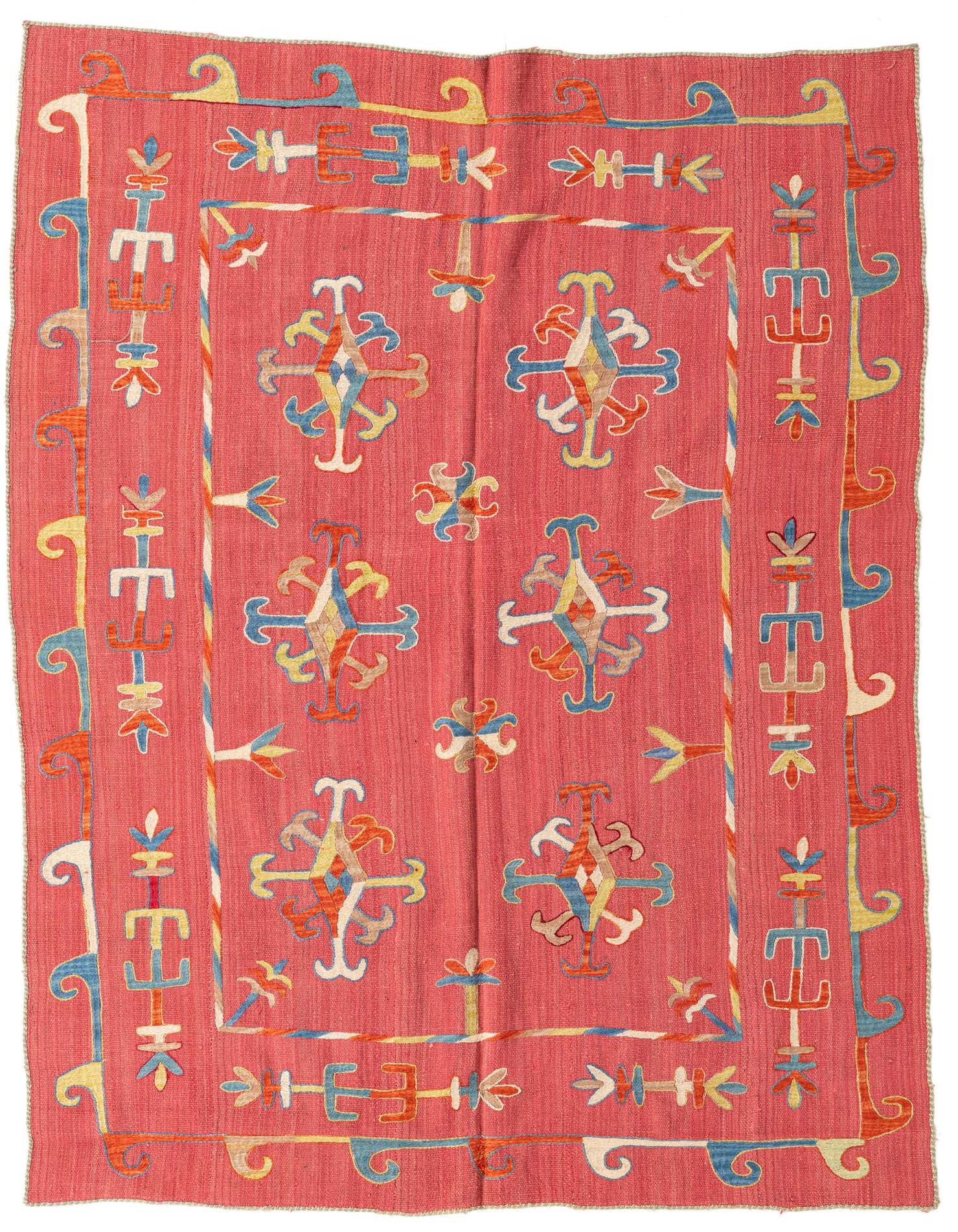 A 5x8 rectangular red Kilim Suzani rug with a tribal, modern, and abstract pattern in blue, yellow, and orange.