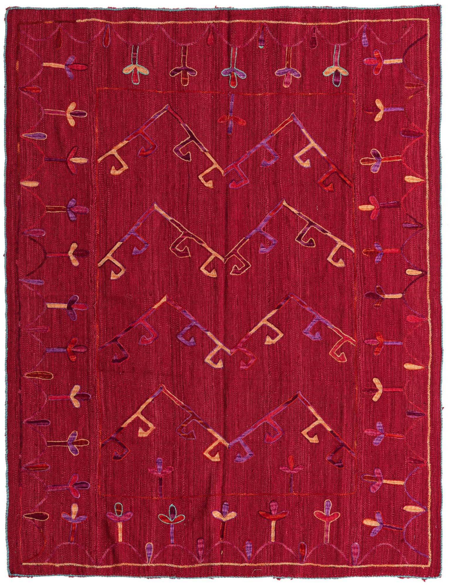 A 5x8 rectangular red Kilim Suzani wool rug featuring a tribal pattern with abstract shapes and colorful accents.