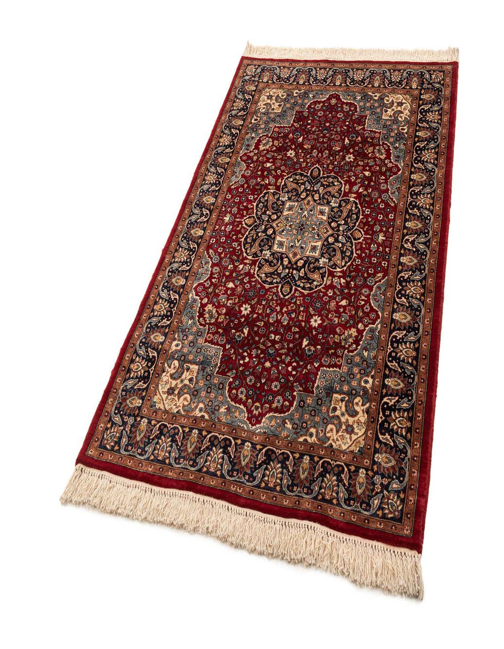 A 4x6 rectangular Lahour traditional rug in rich reds, blues, and creams with an intricate floral medallion pattern and fringed ends.
