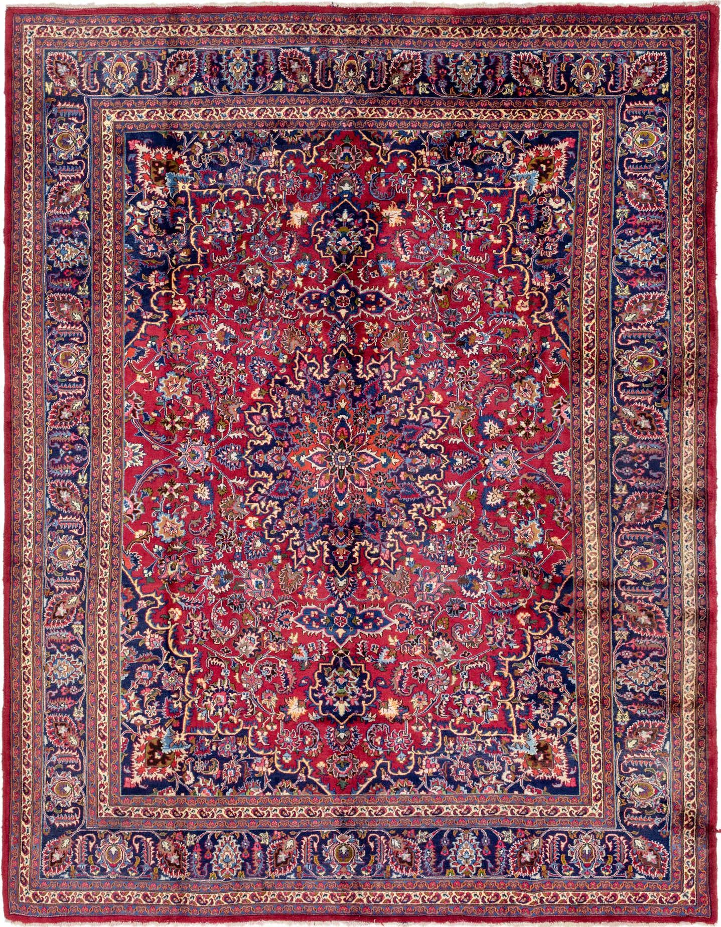 A large 10x13 rectangular red Persian rug with an intricate blue medallion and floral pattern, featuring a detailed border.