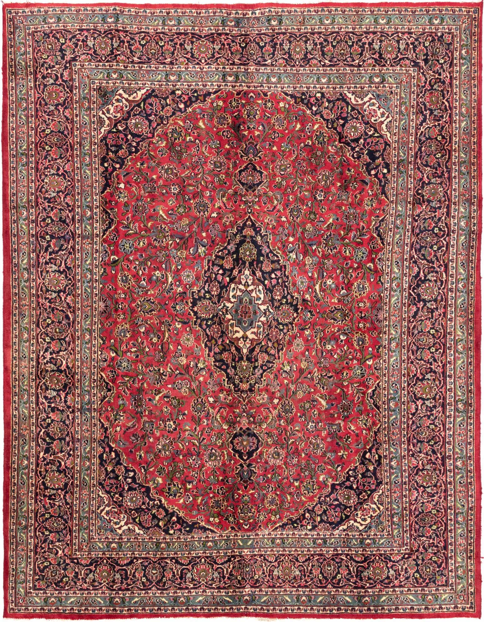 A 10x13 rectangular red Persian rug with an intricate navy medallion and floral patterns, ideal for a traditional living room.