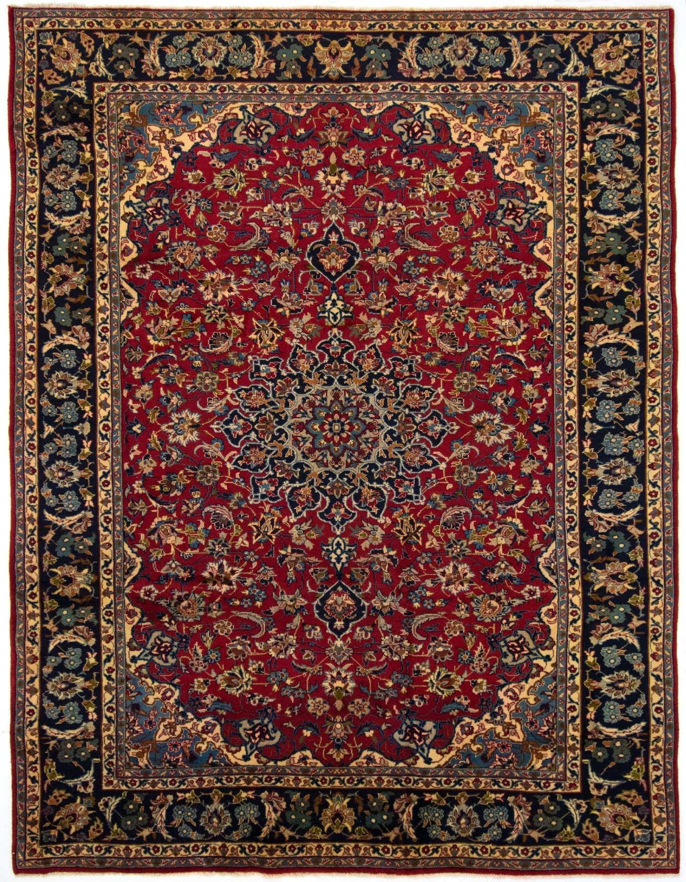 A rectangular 8x11 handmade Persian rug with a deep red field and intricate blue, gold, and green floral patterns, framed by a dark blue border.