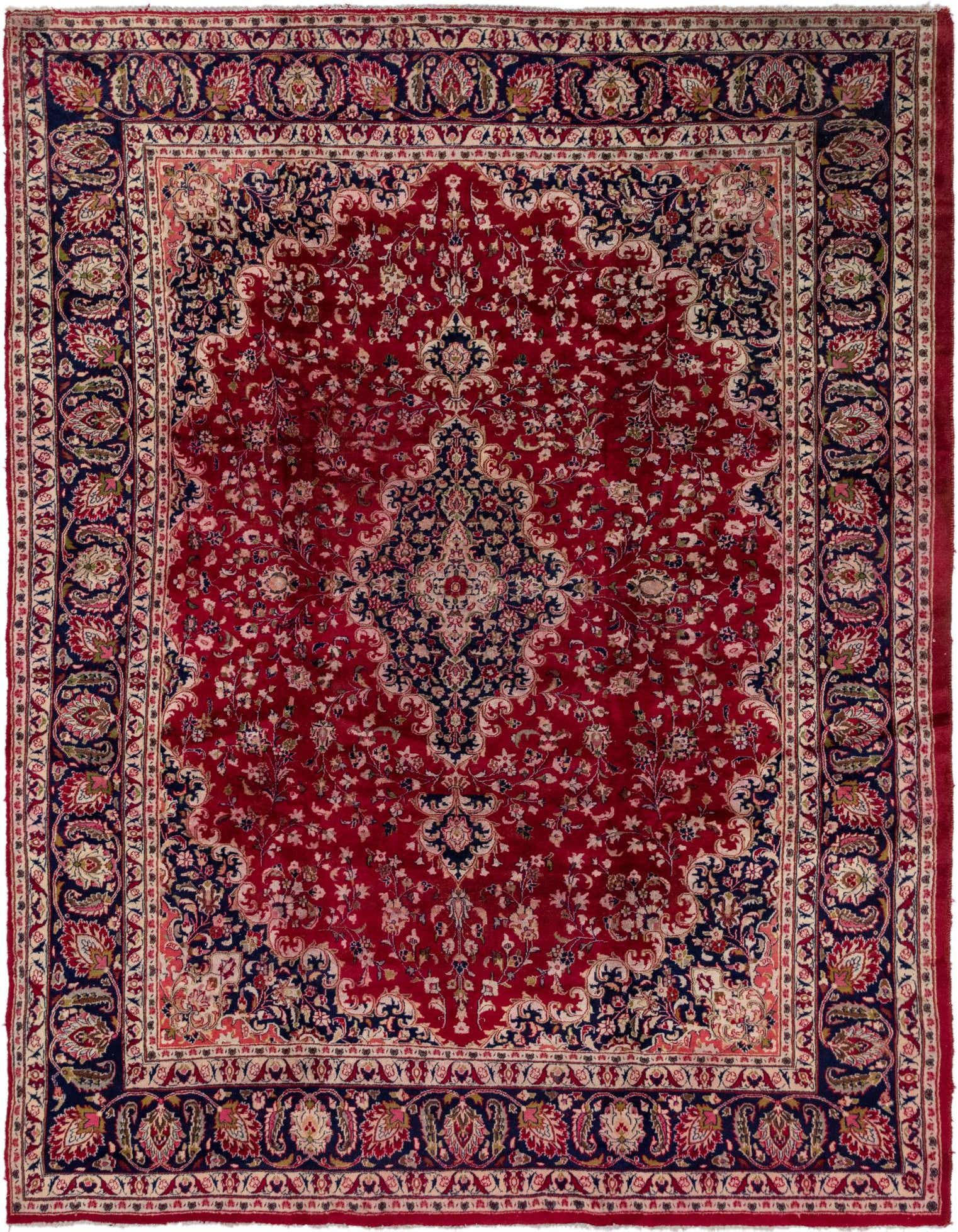 A 10x13 rectangular red Persian rug with an intricate navy blue and cream medallion pattern, ideal for a living room.