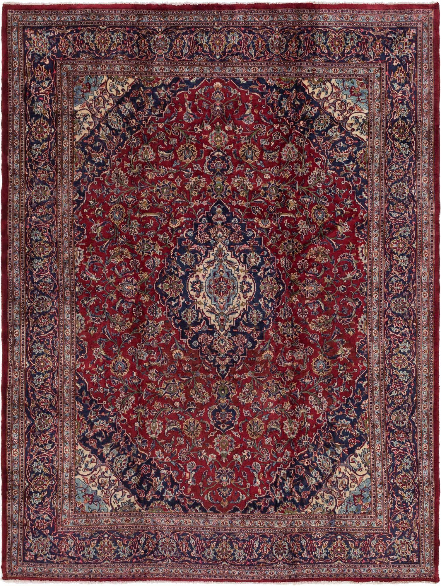 A 10x13 rectangular red Persian rug with a central medallion and intricate botanical patterns in navy, cream, and light blue.