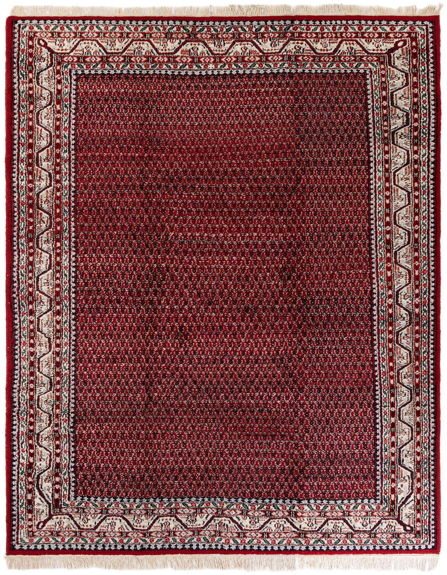 A rectangular 8x11 traditional Mir wool rug in deep red with an intricate border pattern and fringe.