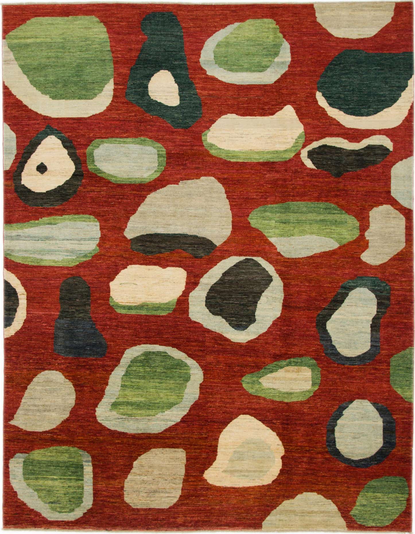 A vibrant 8x12 rectangular rug featuring an abstract pattern of organic shapes in green, blue, and cream on a rich red background.