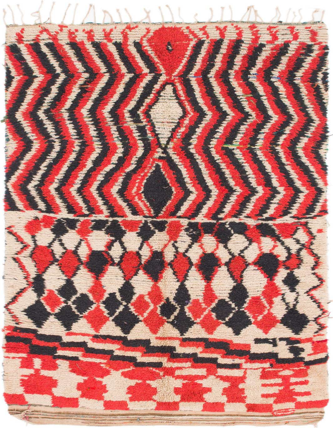 A 5x8 rectangular Moroccan shag rug with a bold tribal pattern in red, black, and cream, featuring zigzags and diamond shapes.