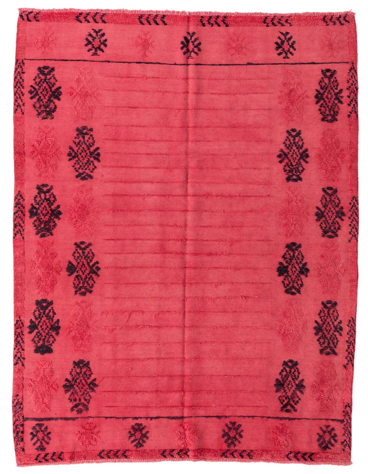 A 5x8 rectangular red shag rug with black tribal patterns along the borders and horizontal textured lines in the center.
