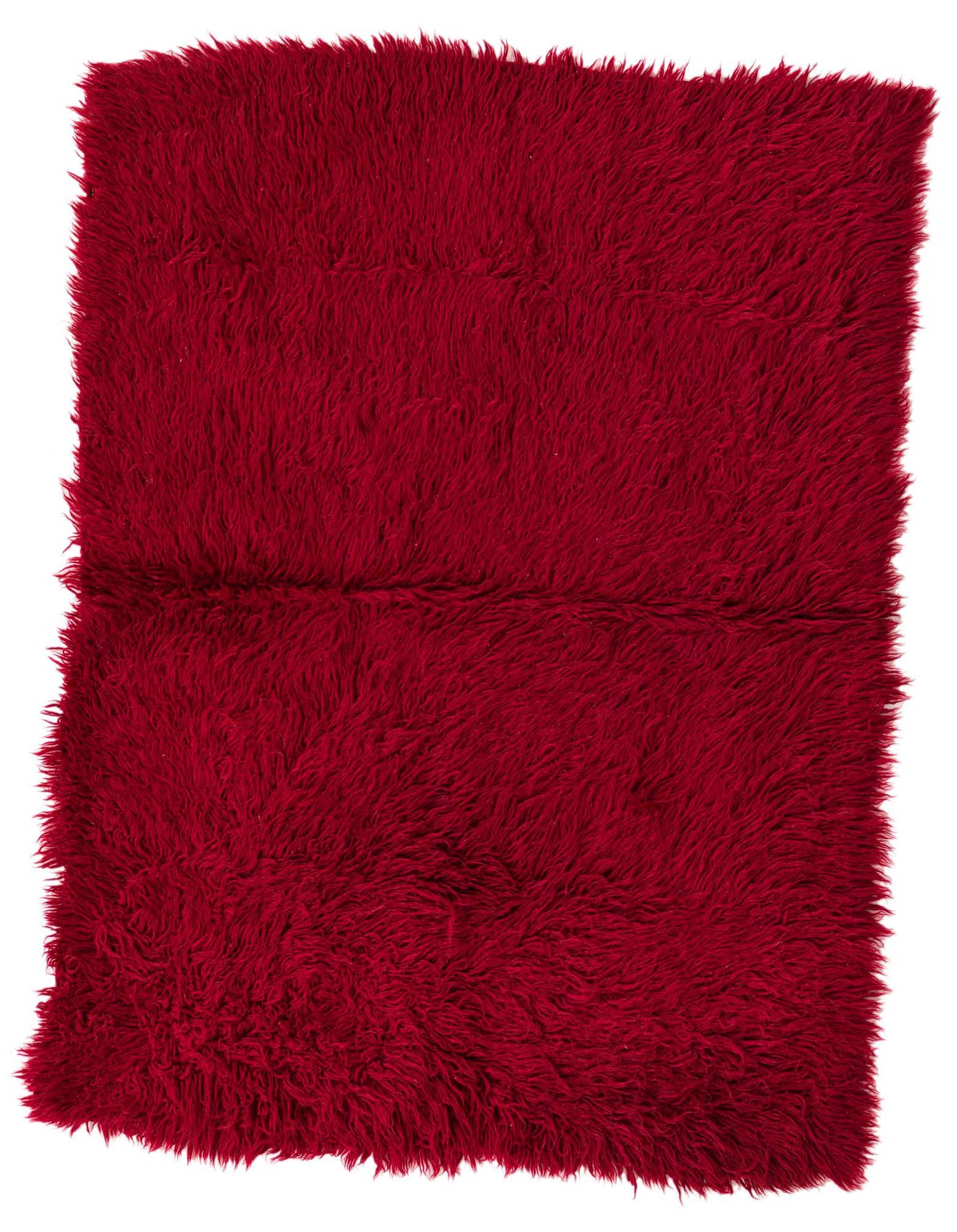 A rectangular 3x5 red shag rug with a plush, soft texture, handmade from wool, perfect for an indoor living space.