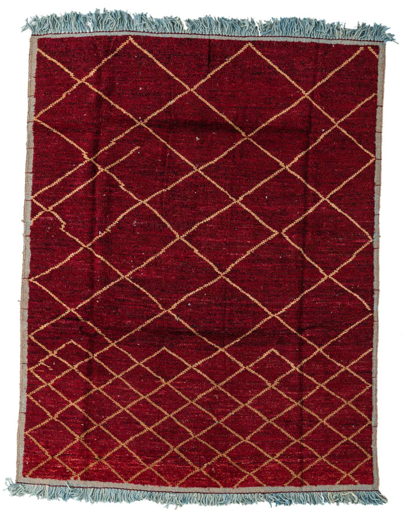 A 6x9 rectangular red Moroccan shag rug with a repeating gold diamond pattern and light blue fringe.
