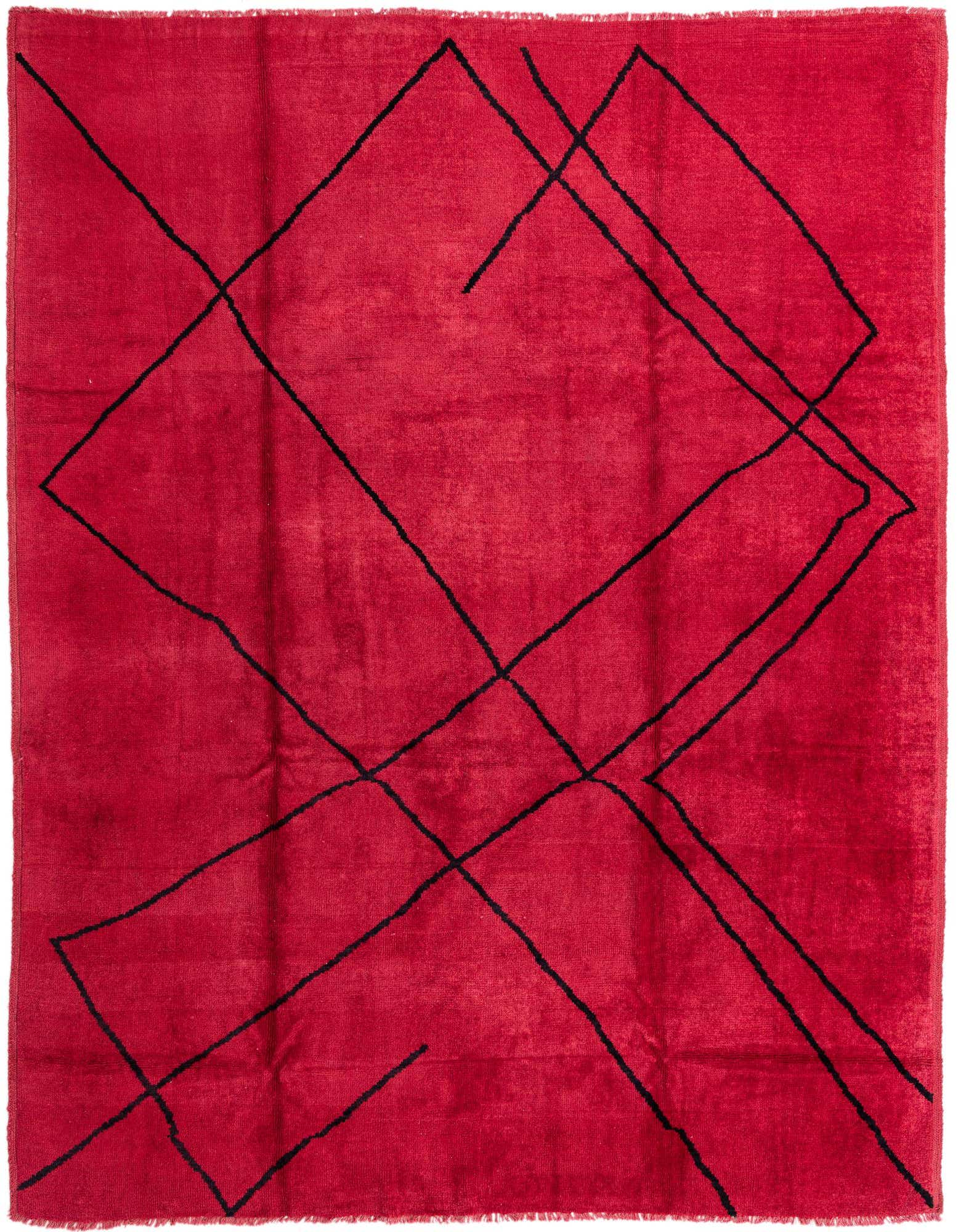 A 9x12 rectangular red shag rug with an abstract black tribal pattern, perfect for a living room.