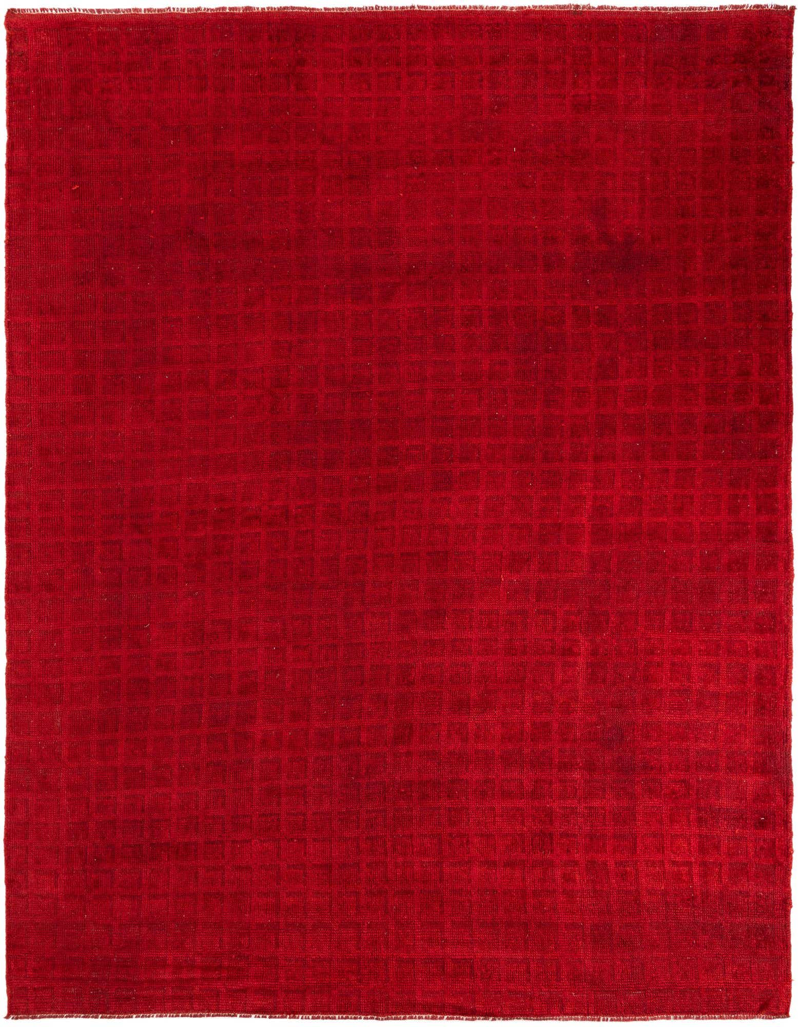 A rich red 8x10 rectangular shag rug with a subtle tribal pattern, ideal for a living room.