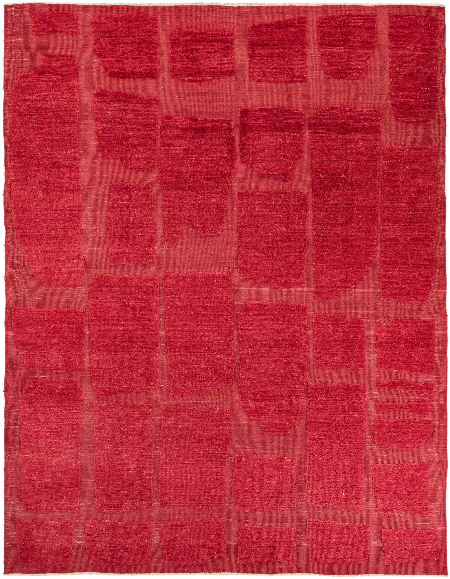 A rectangular 8x11 red shag area rug with an abstract tribal pattern of raised rectangular shapes.