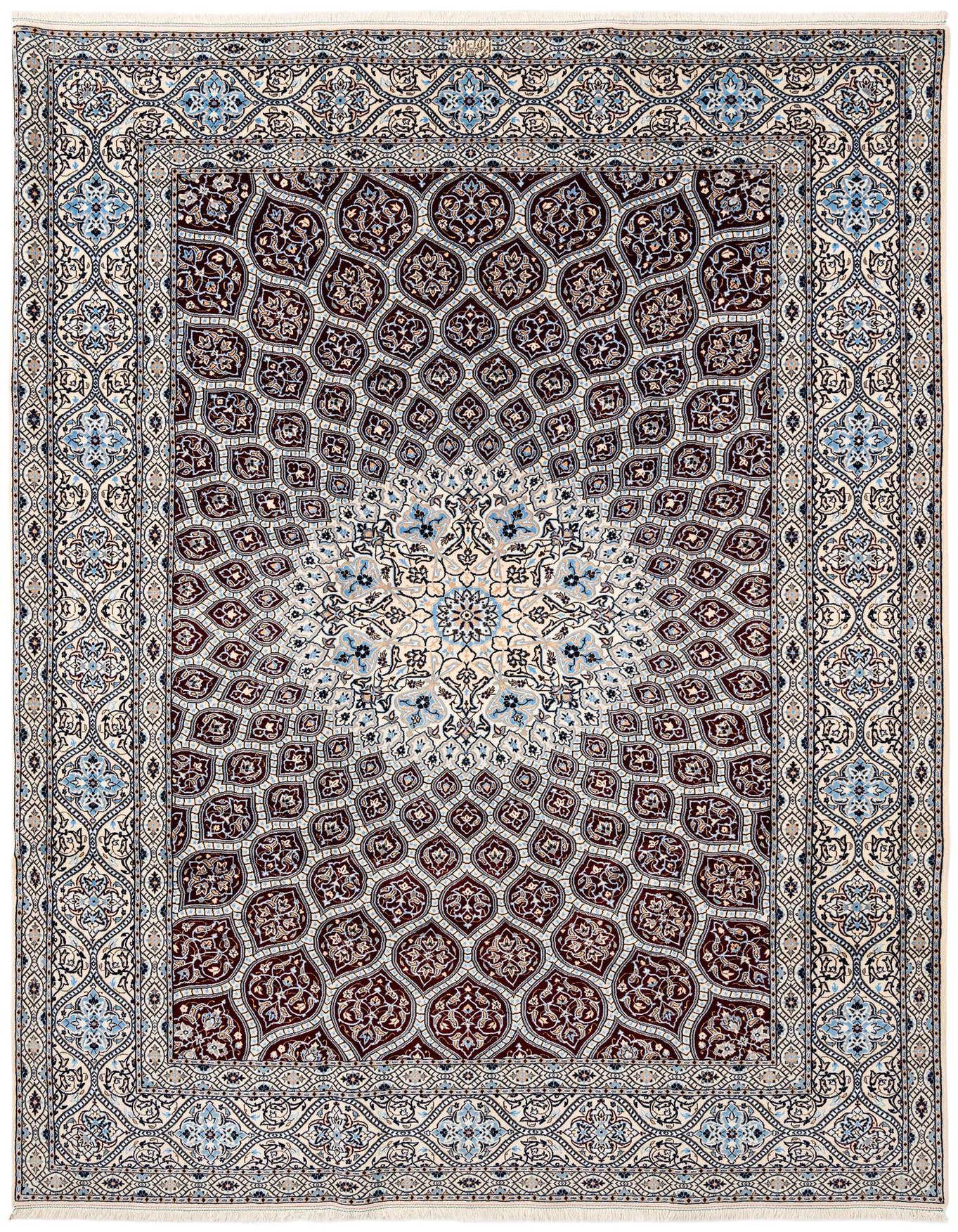 A 6x9 rectangular handmade wool rug featuring a central medallion and intricate traditional patterns in shades of red, blue, and cream.