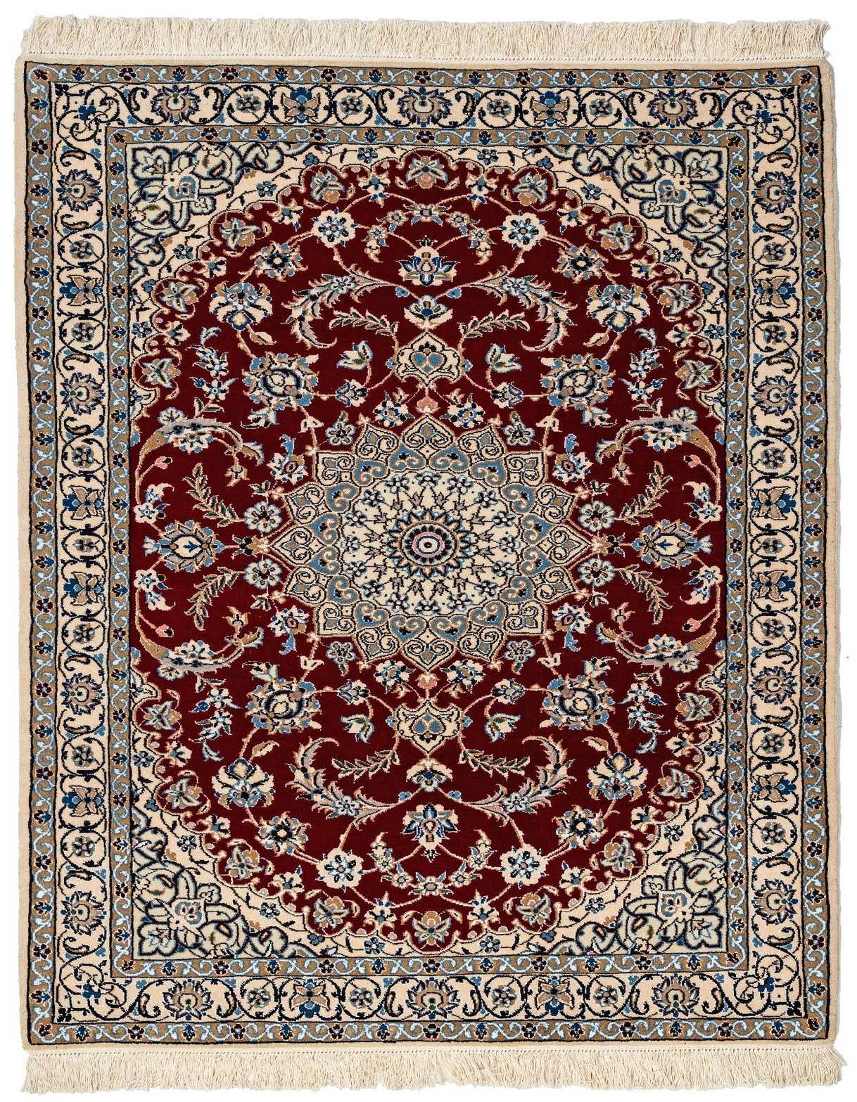 A 3x5 rectangular handmade rug featuring a deep red field with an intricate floral medallion pattern in cream, blue, and gold, framed by a detailed border.