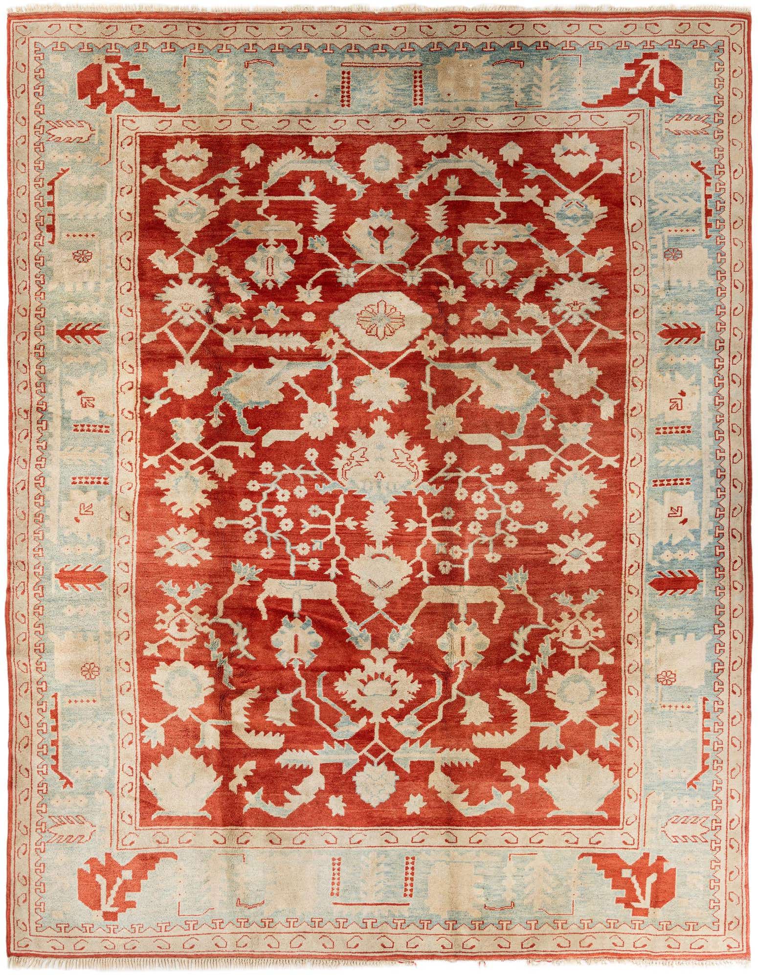 A 9x12 rectangular Peshawar Ziegler rug featuring a vibrant red field with intricate cream and light blue floral and oriental patterns, bordered by a light blue and cream frame.