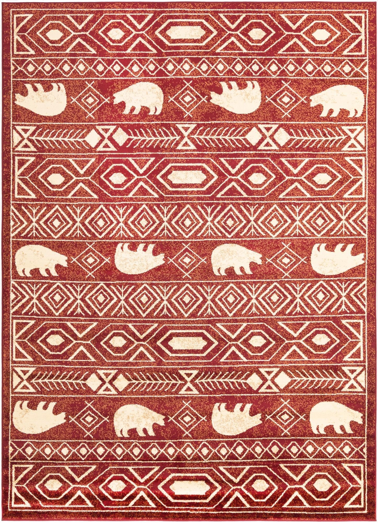 A 7x10 rectangular red area rug with a rustic tribal pattern featuring white bear silhouettes and geometric stripes.