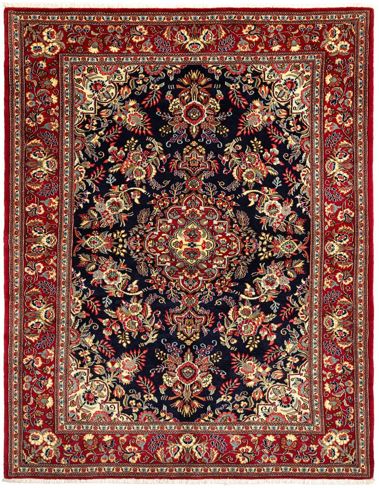 A 5x7 rectangular Persian rug with a deep red border and a navy blue field, featuring intricate floral and medallion patterns in red, gold, and light blue.