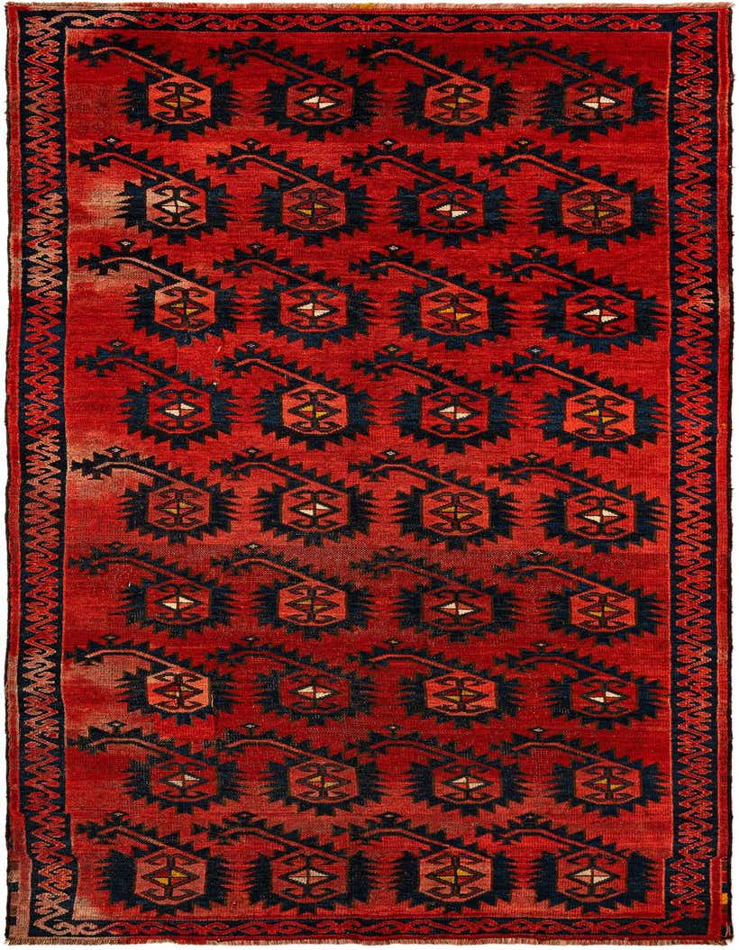 A 6x9 rectangular red wool rug with a repeating pattern of dark blue, geometric motifs, ideal for a living room.
