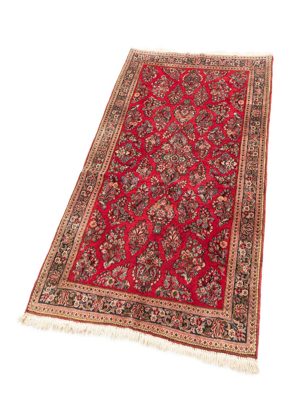 A 4x6 rectangular red area rug with a detailed traditional floral pattern and a dark border, handmade from sheep virgin wool.
