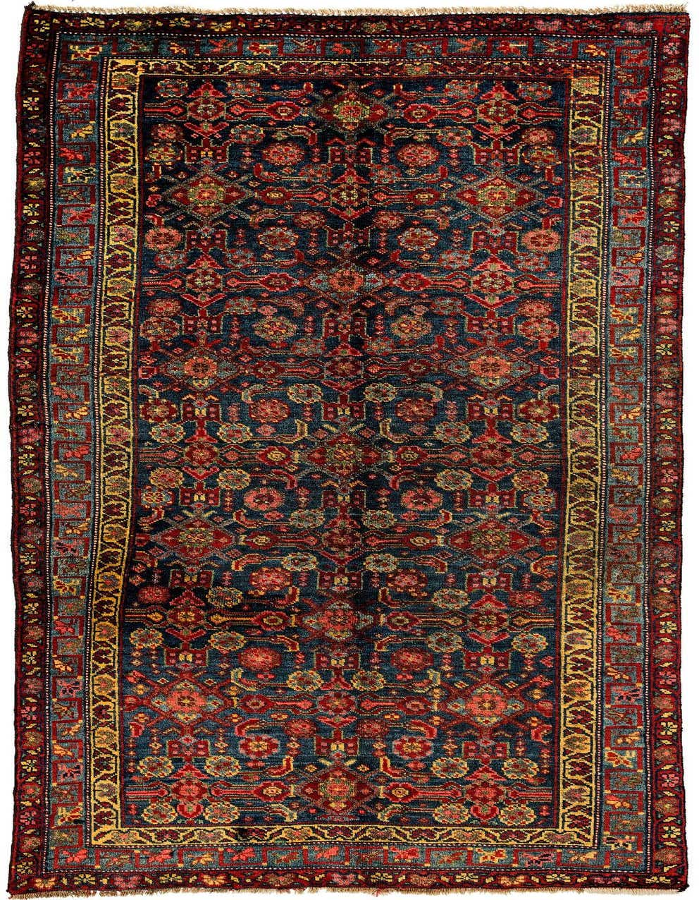 A rectangular 5x8 Saudjboulag rug featuring a complex traditional pattern in various shades of red, blue, and gold.