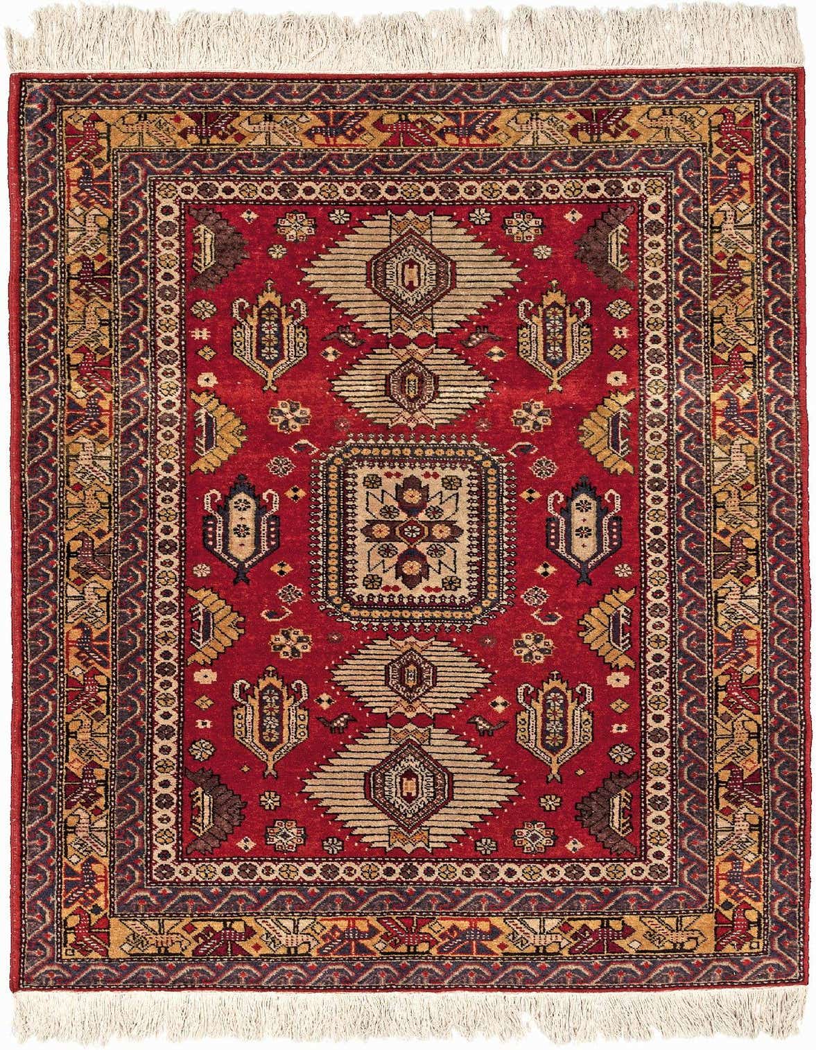 A 3x5 rectangular red wool rug with intricate traditional patterns in gold, navy, and brown, featuring a central medallion and multiple borders.