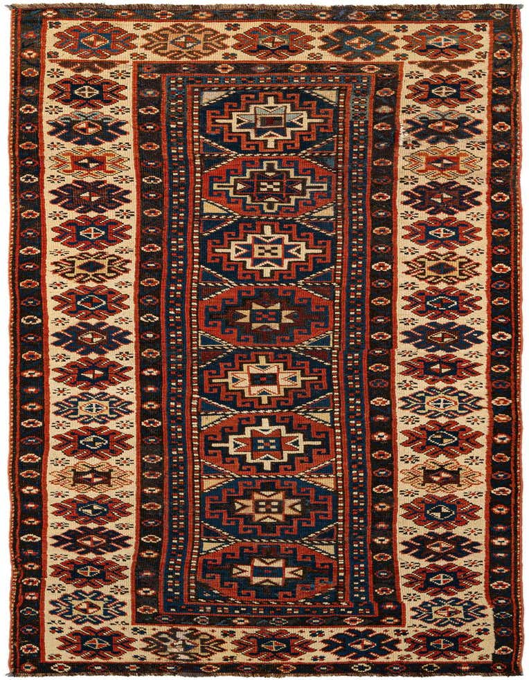 A 5x8 rectangular Shirvan tribal rug featuring deep reds, blues, and cream in a geometric pattern, perfect for an entryway or living room.