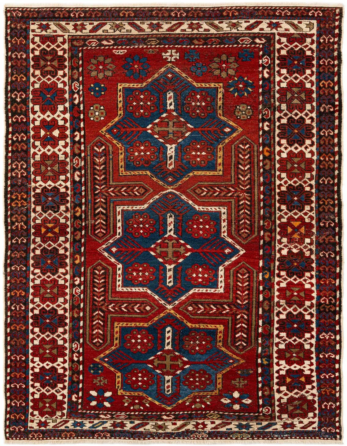 A 5x8 rectangular Shirvan tribal wool rug featuring a deep red field with intricate blue, white, and gold geometric patterns.