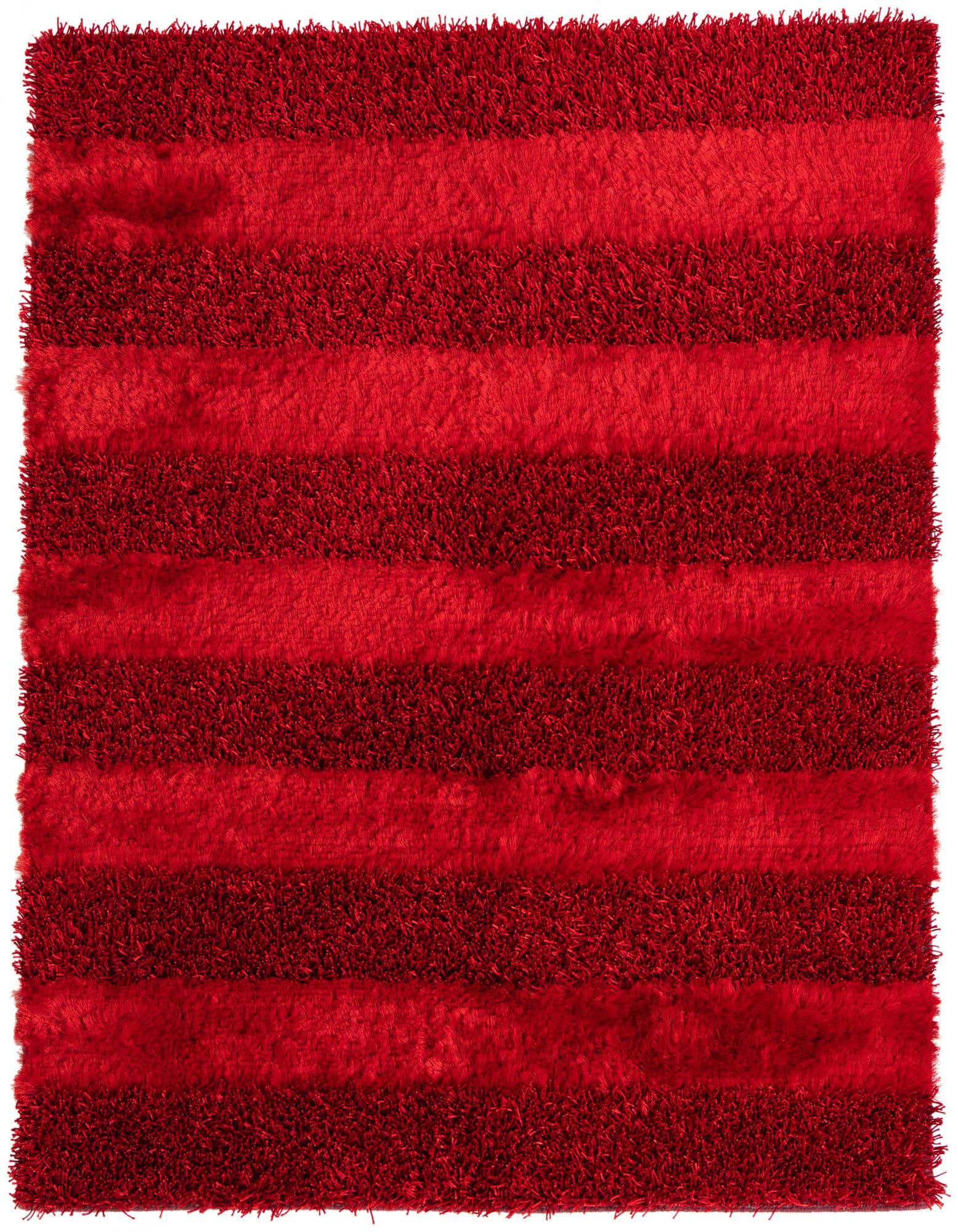 A vibrant 5x7 rectangular red shag rug featuring alternating stripes of plush and textured pile.