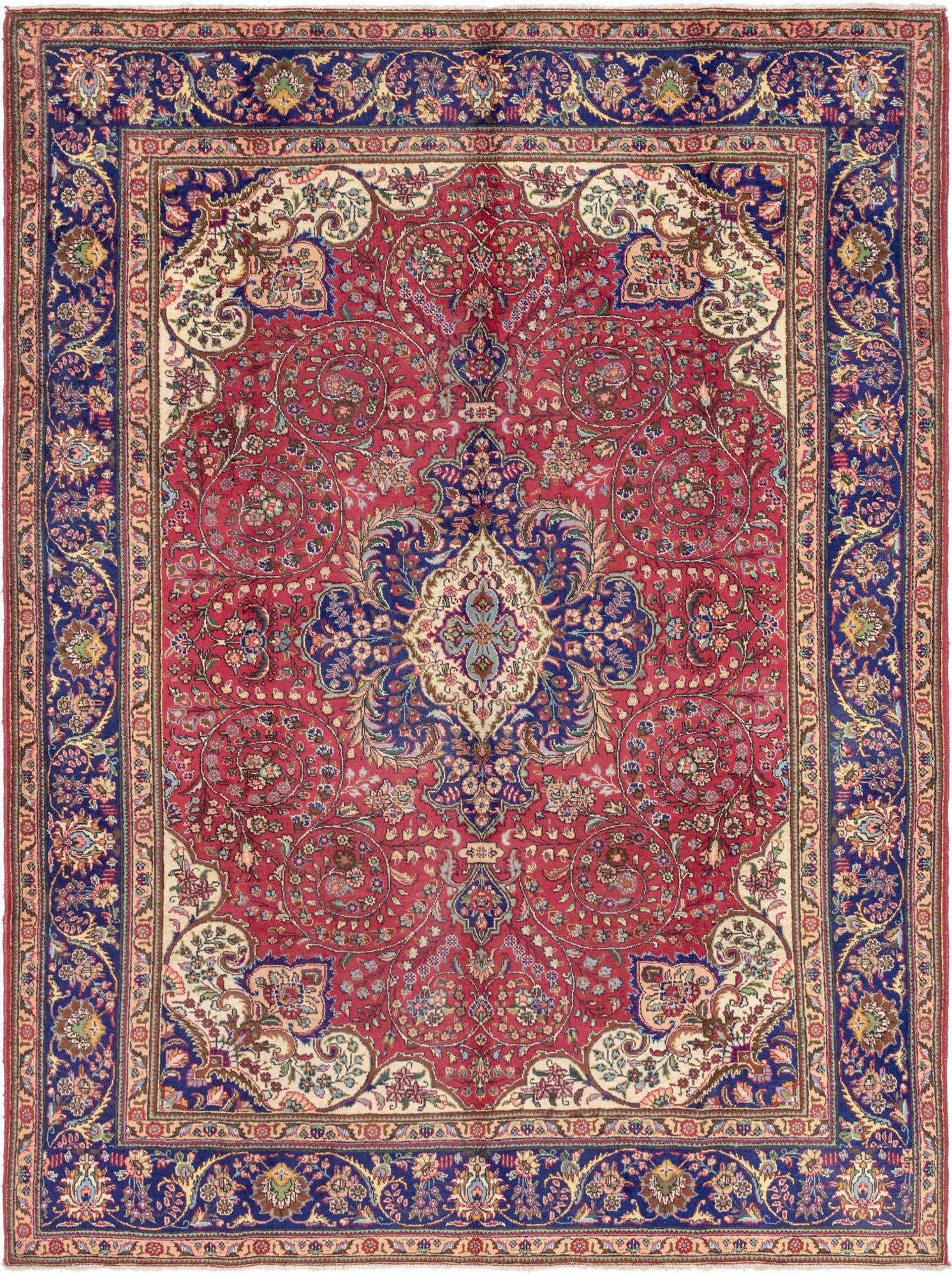 A large 10x13 rectangular red Persian rug with a central medallion and intricate botanical patterns, framed by a wide navy blue border.