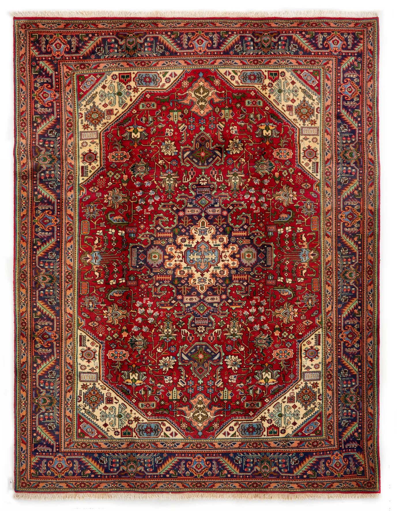 A 7x10 rectangular red Persian wool rug with intricate floral and medallion patterns in blues, creams, and greens.