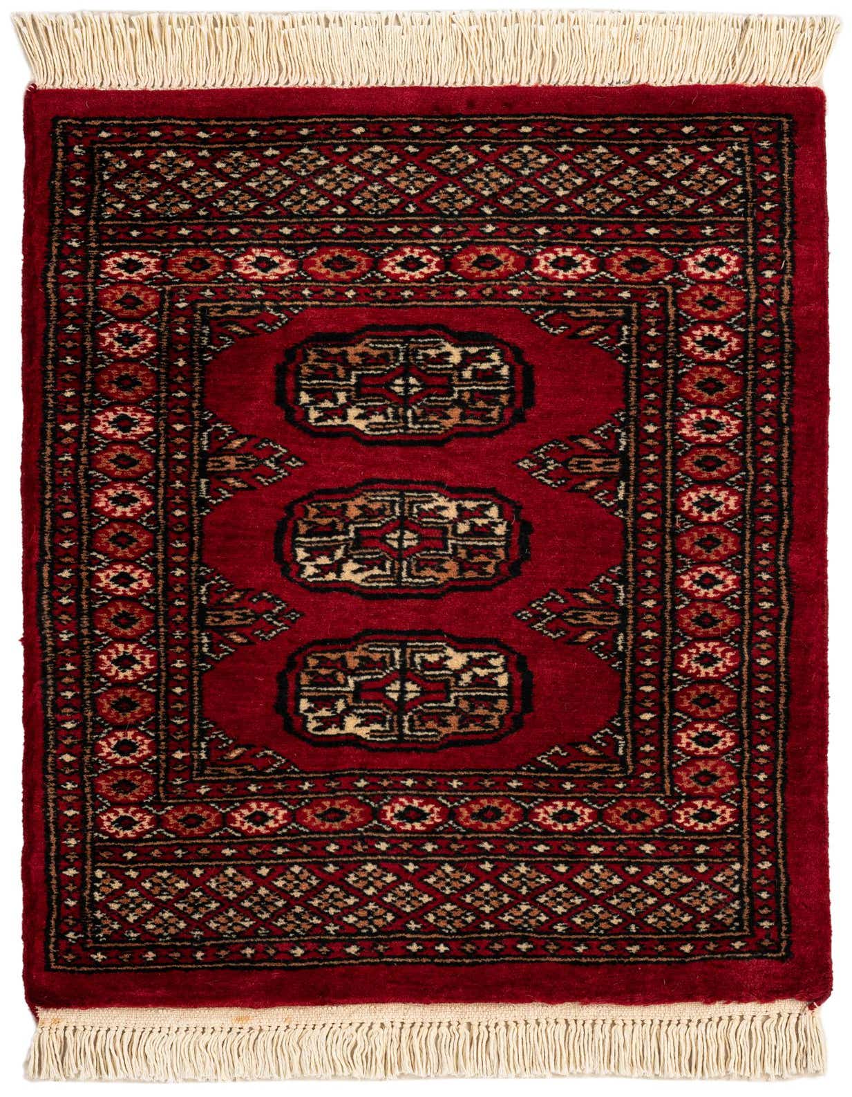 A 2x3 rectangular Torkaman rug featuring a traditional Persian pattern with a deep red background, intricate black, beige, and red motifs, and cream fringe.