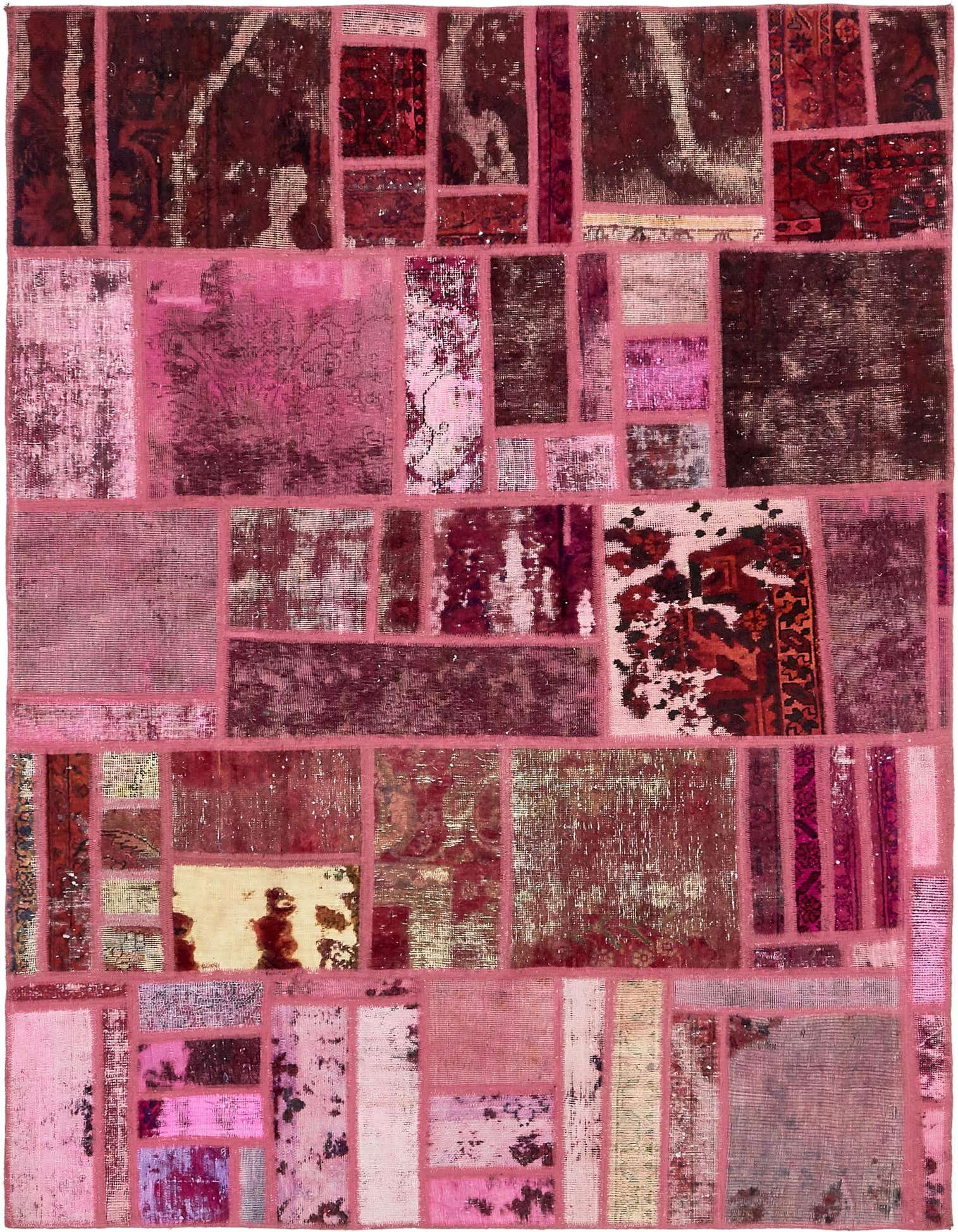 A 6x9 rectangular patchwork rug in various shades of red and pink, featuring distressed vintage and abstract patterns.