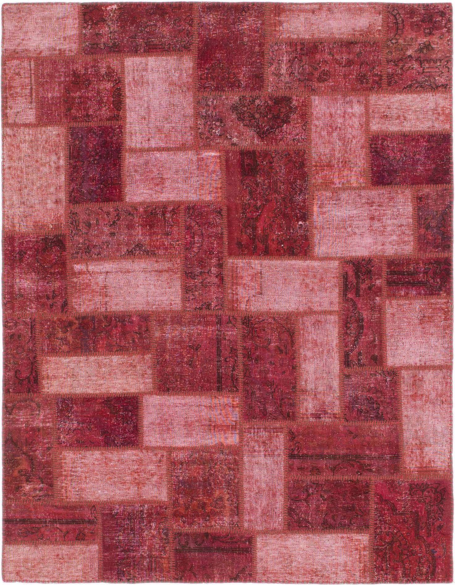 A 5x7 rectangular patchwork rug in varying shades of red, featuring distressed Persian and abstract patterns, suitable for indoor spaces.