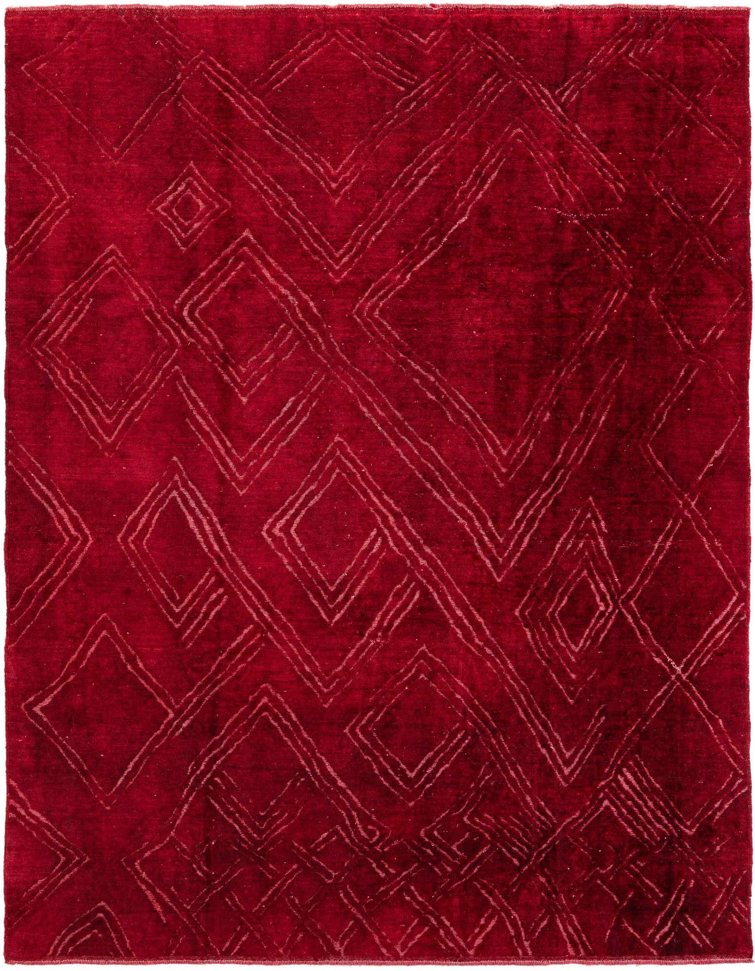 A rectangular 8x10 red wool rug with a subtle abstract geometric pattern of outlined diamonds and lines.