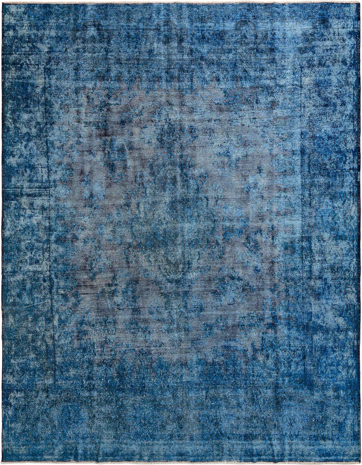 A 10x13 rectangular Persian rug in varying shades of deep blue with a distressed vintage pattern, suitable for a living room.