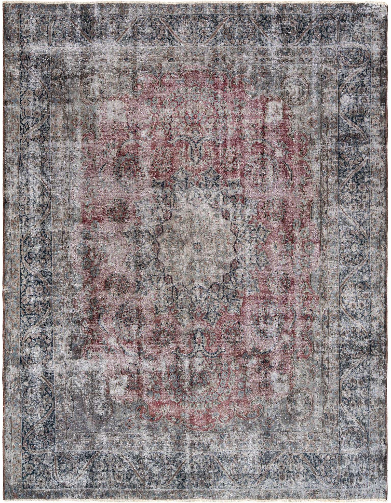 A 10x13 rectangular Rugs.com Vintage Royal Persian rug with faded red and gray tones, featuring intricate traditional patterns.