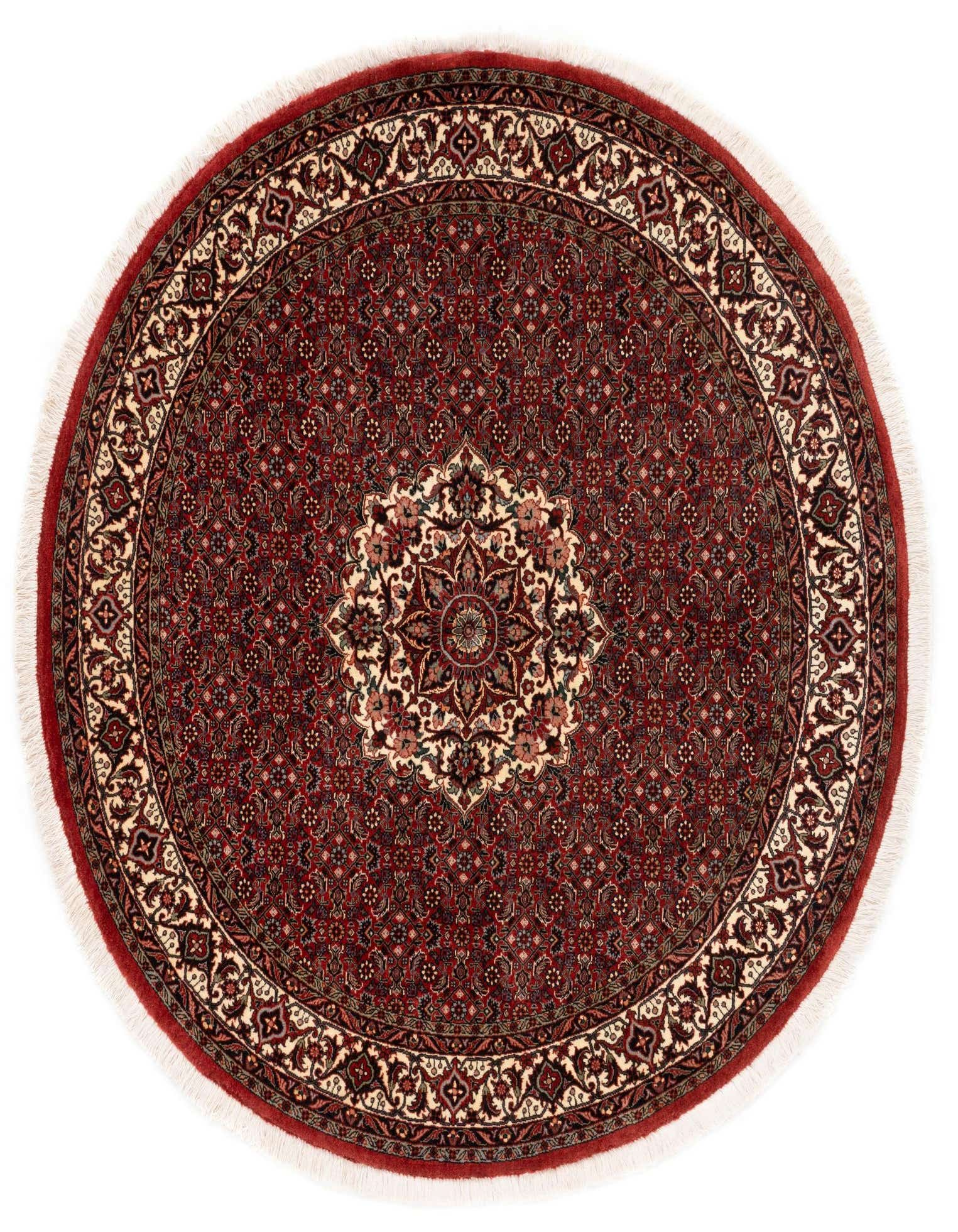 A 5' round red Persian rug with a detailed central medallion and intricate floral patterns in cream and dark accents.