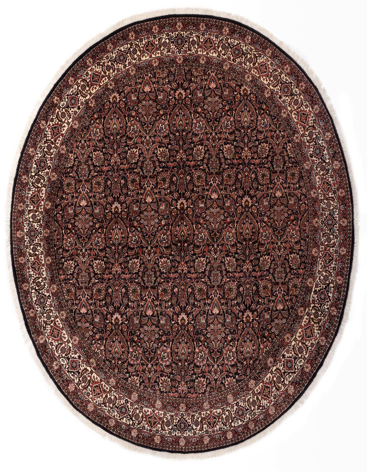 A round 8'1" x 8'1" Persian rug with a deep red and black floral pattern, featuring an intricate border and white fringe.