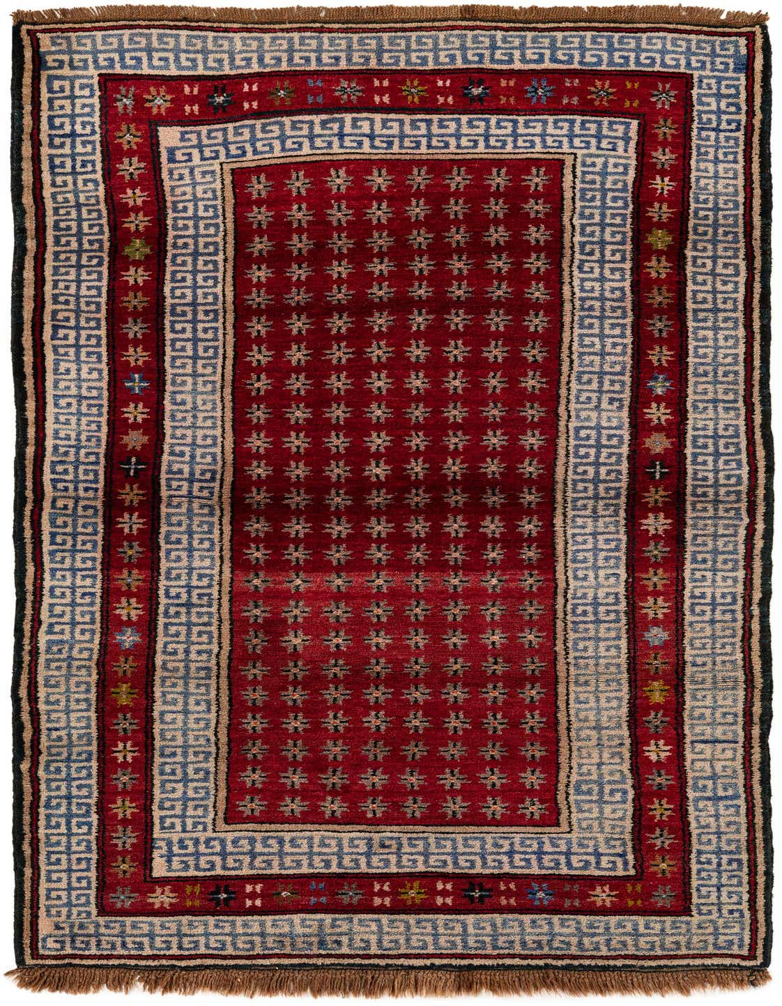 A 7 ft runner rug in traditional tribal style, featuring a deep red field with repeating star motifs and a blue and beige geometric border.