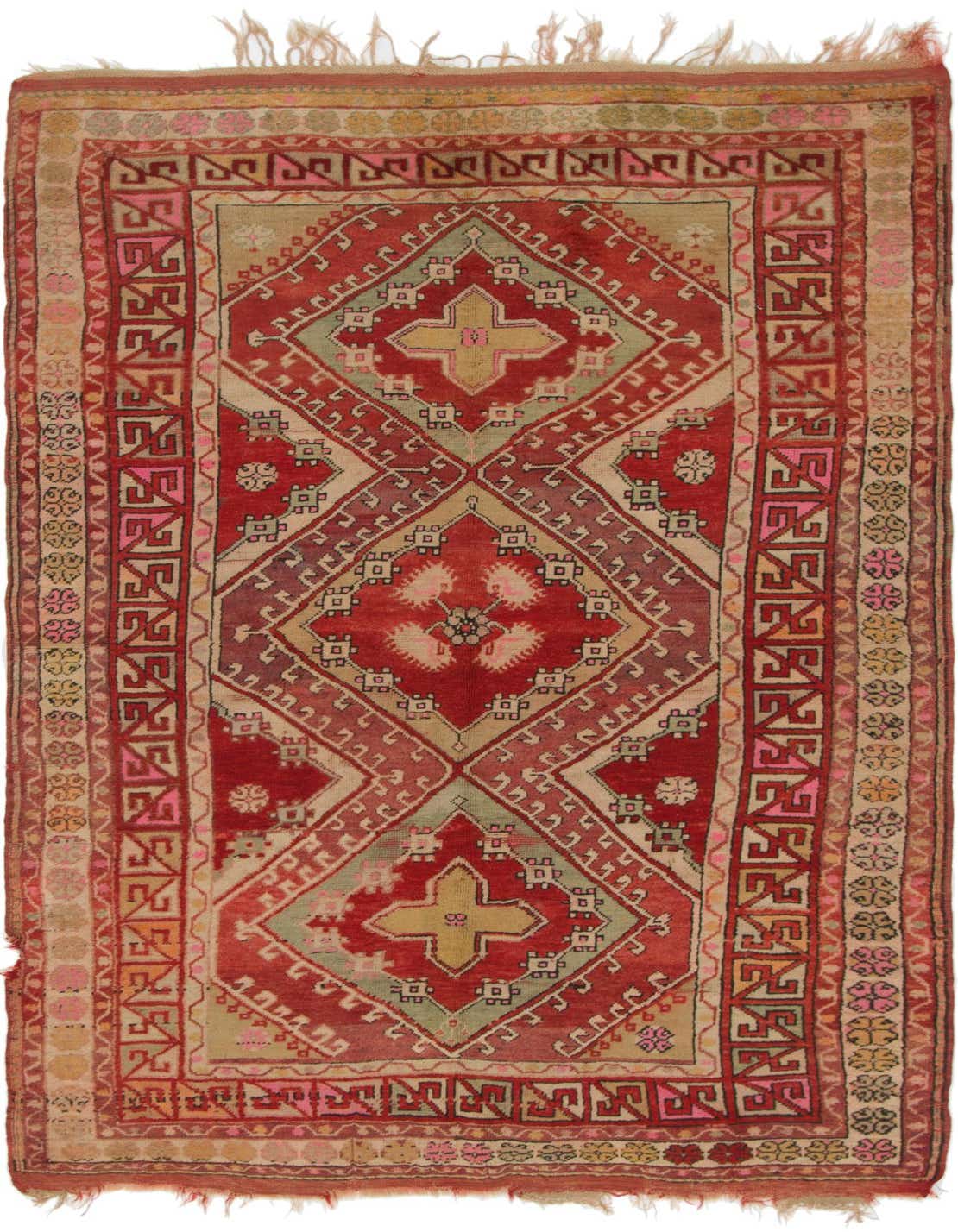An 8 ft runner rug from the Anatolian collection, featuring a traditional tribal medallion pattern in various shades of red, beige, and subtle green, with fringed ends.